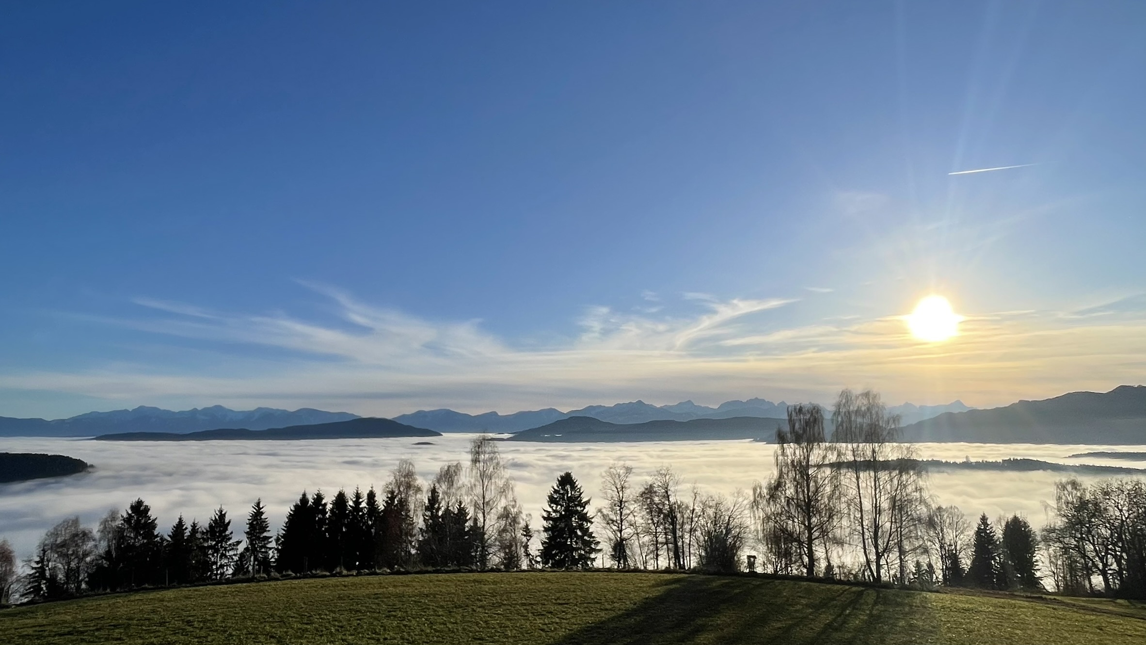 Sunrise over a sea of fog in the Carinthian mountains