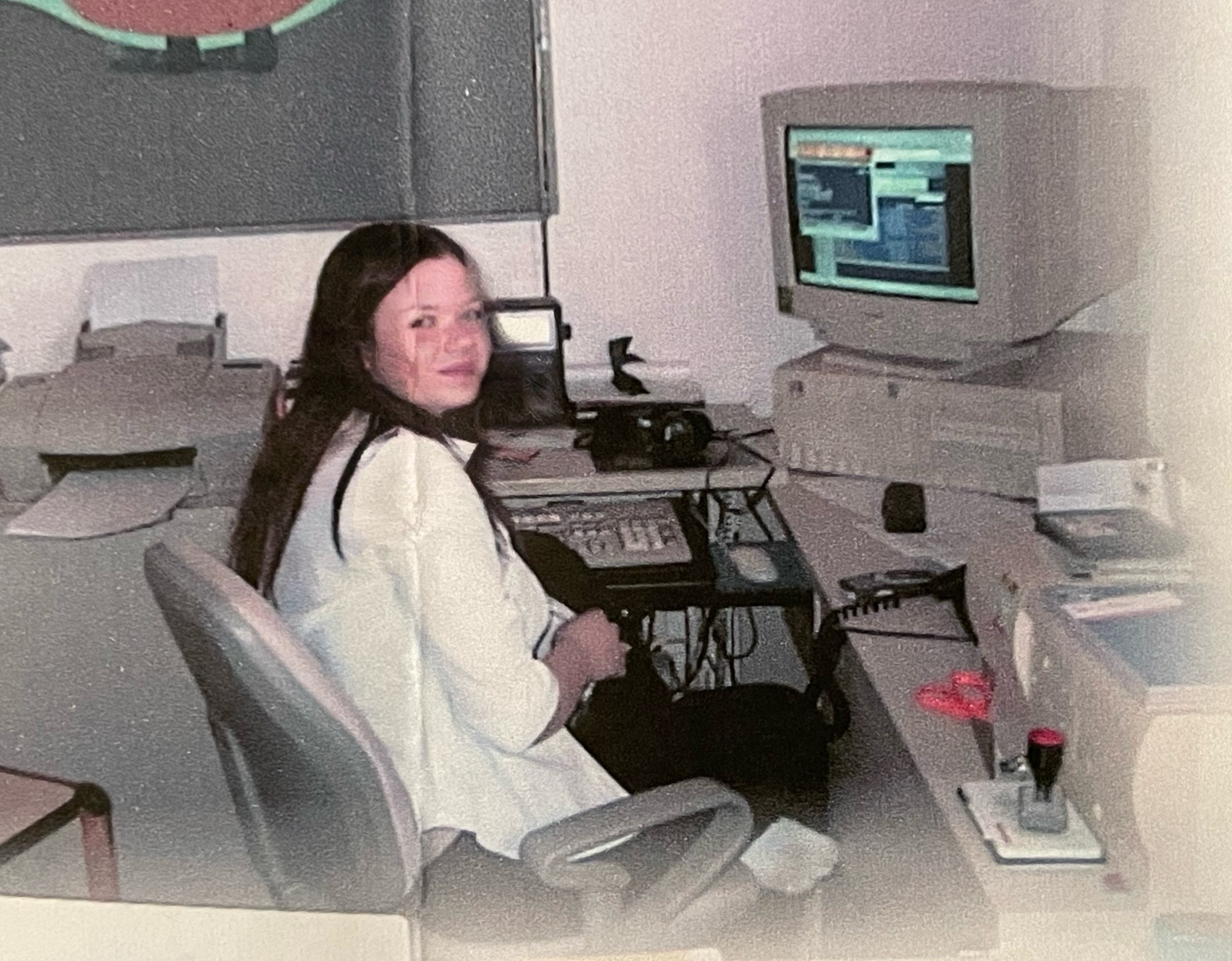 A young Michaela at an early computer workstation